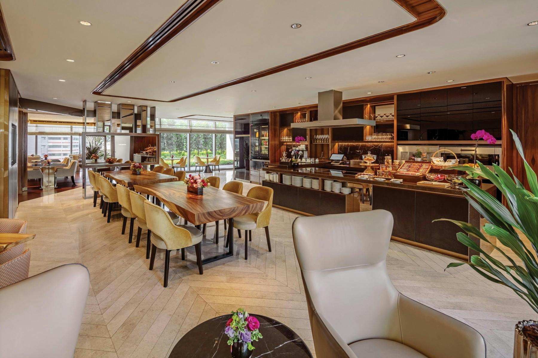 Modern meeting space at Sofitel Singapore with large dining table for events.