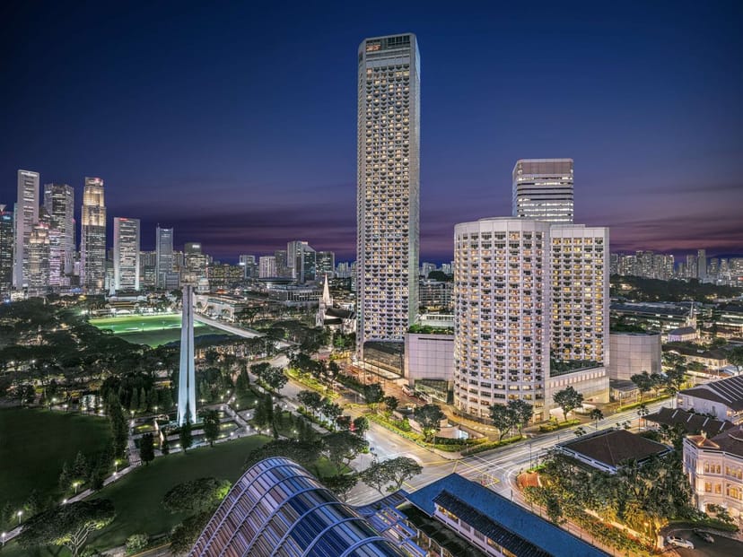 Fairmont Executive Meeting Rooms with urban skyline at dusk, ideal for corporate events.