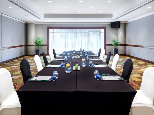 Boardroom at Holiday Inn Singapore Atrium, elegant setup for professional events and meetings.
