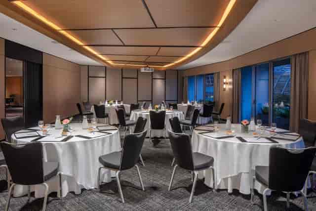 Fairmont Executive Meeting Room with round tables, ideal for corporate events in Singapore.