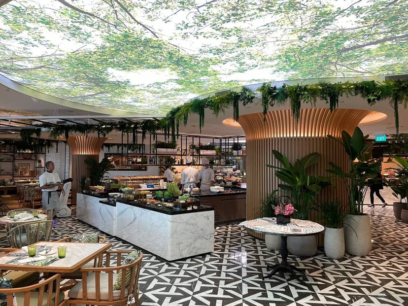 Modern event space at Mandarin Oriental, Singapore with lush greenery and stylish decor.