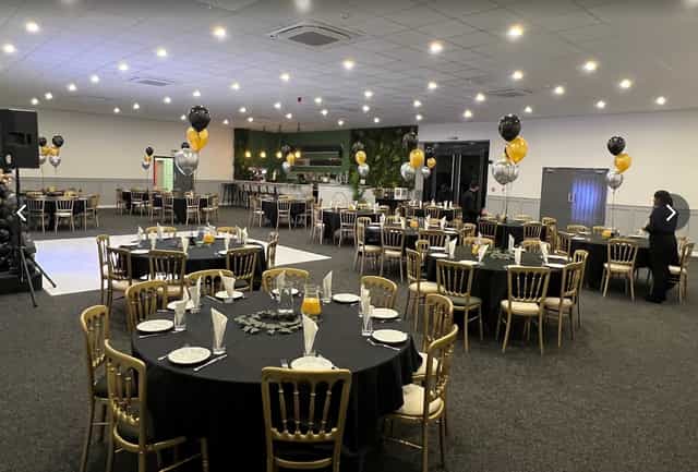 Elegant No.4 Events Hall with black and gold decor for formal gatherings and celebrations.