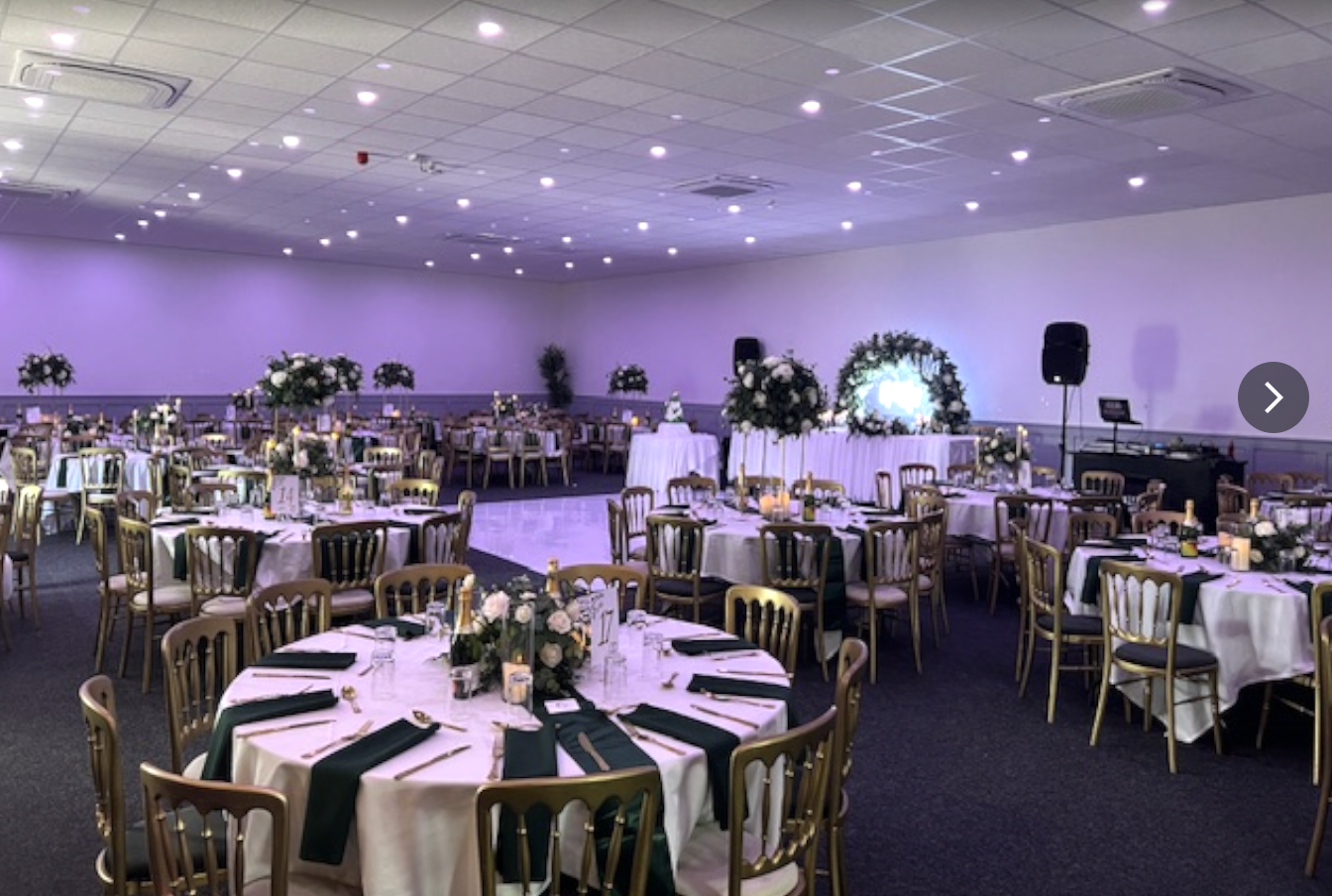 Elegant event space with round tables, ideal for weddings and formal gatherings.