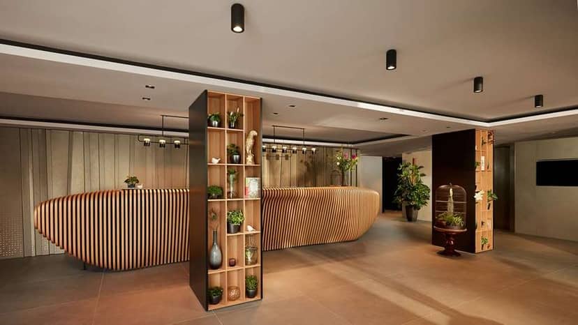 Modern reception area with curved desk for corporate meetings at Park Plaza Vondelpark.