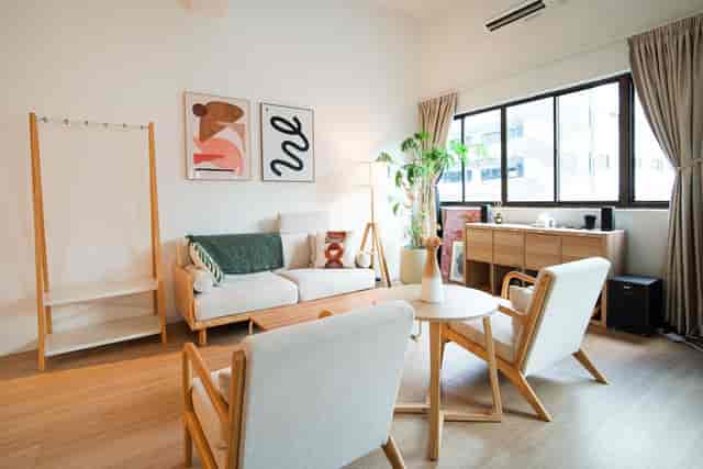 Modern photography studio with cozy seating for creative meetings and brainstorming sessions.