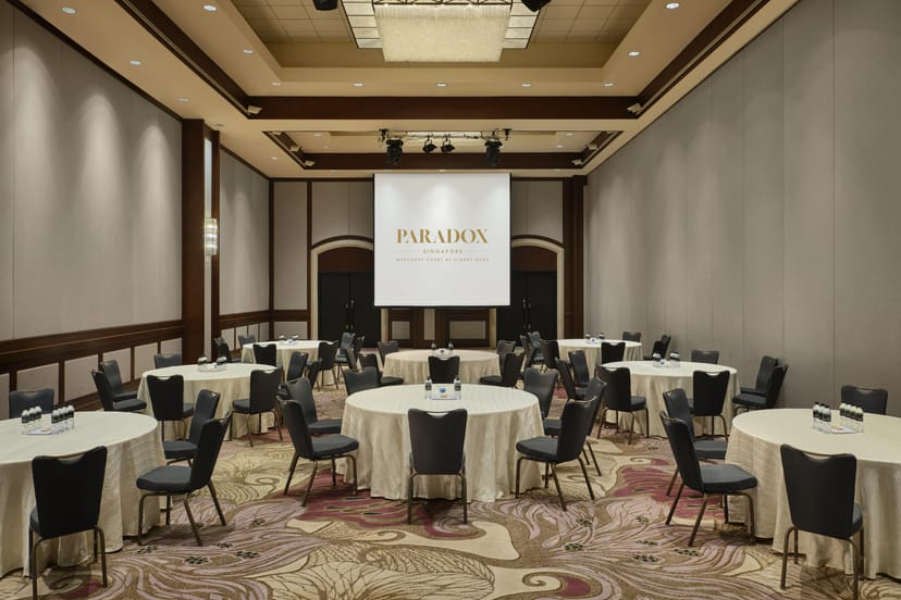 Merchant Court Ballroom in Singapore, featuring round tables for corporate events and presentations.