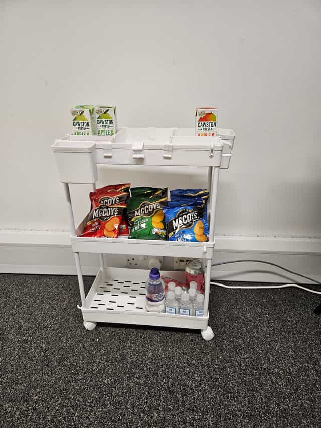 Individual counselling snack station with McCoy's crisps and juice boxes at Basepoint Dartford.