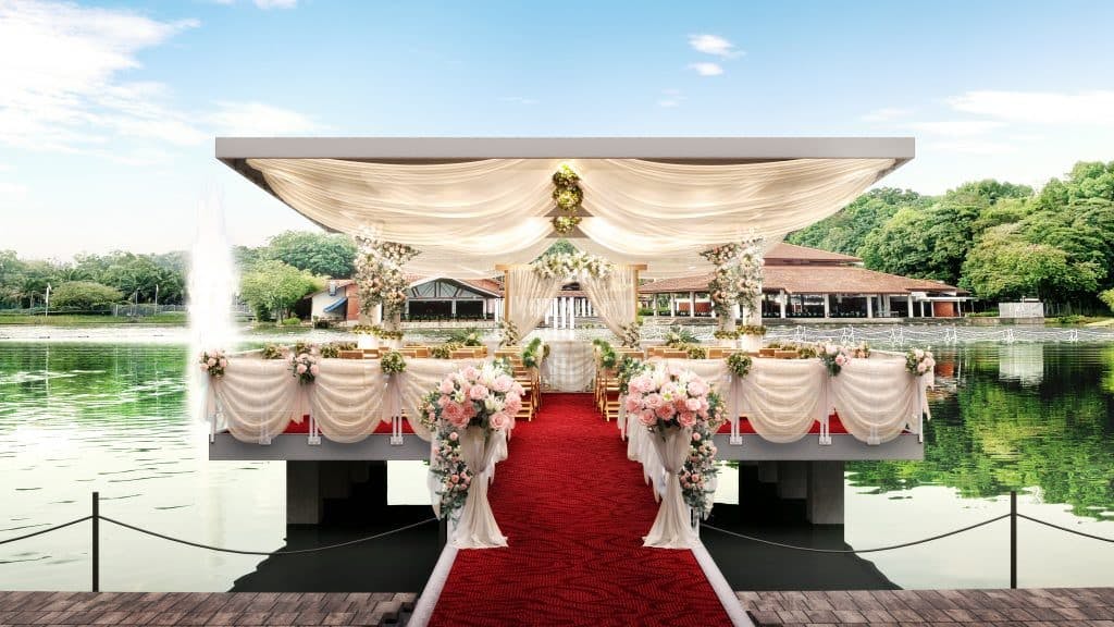 Outdoor wedding venue at Singapore Discovery Centre with elegant decor and lush greenery.