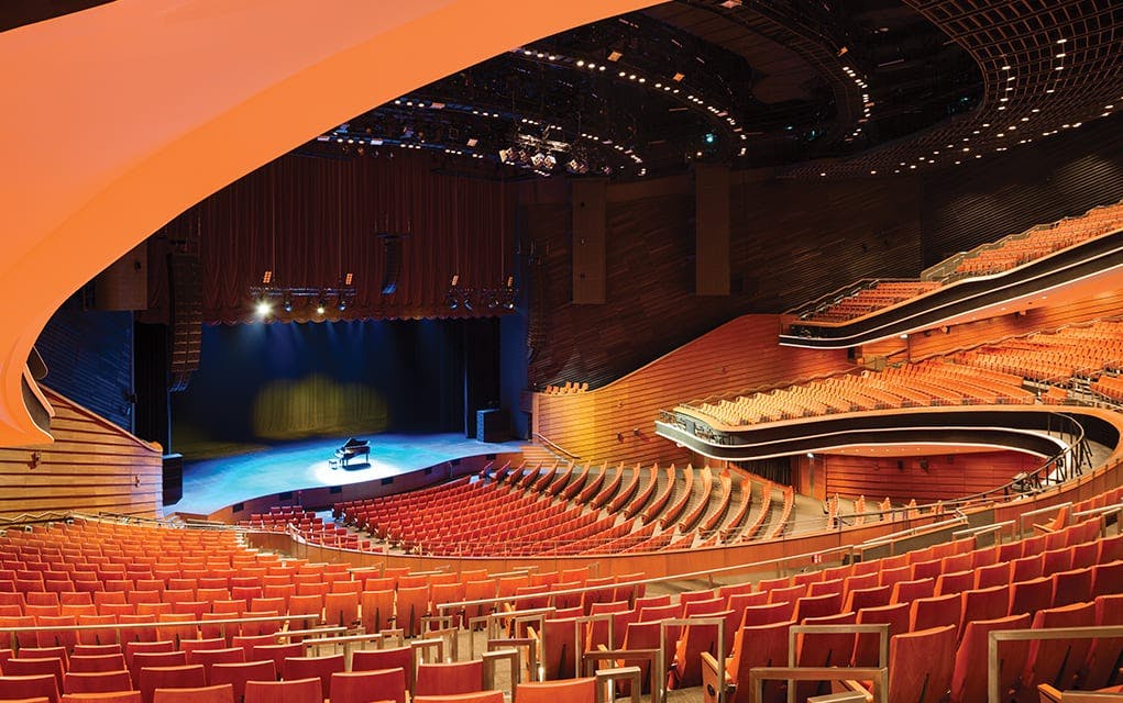 Modern auditorium with tiered seating, ideal for conferences and concerts.