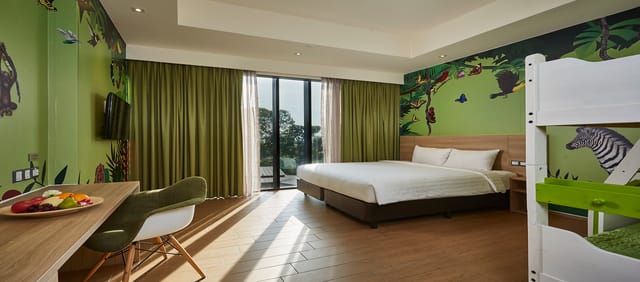 Comfortable hotel suite with nature-themed decor, perfect for events and meetings.