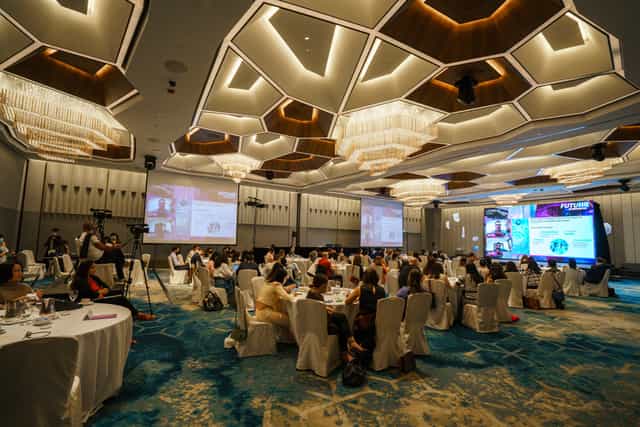 Pacific Ballroom in Pan Pacific Singapore, spacious conference setting with round tables.