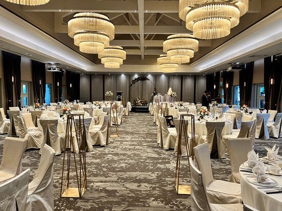 Elegant Revelry Hall event space with chandeliers, ideal for weddings and gatherings.