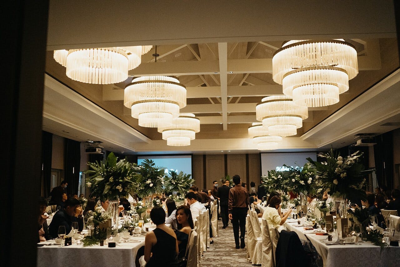 Elegant banquet hall with floral centerpieces, ideal for corporate events and upscale celebrations.