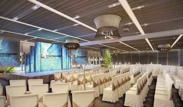 Modern event space at The Commune, featuring a stylish stage for corporate conferences.