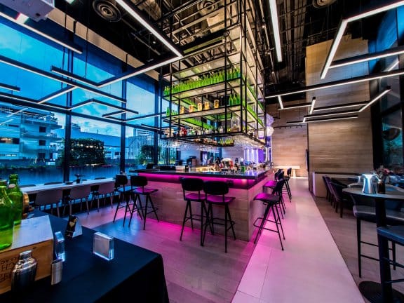 Modern bar area in YOTEL Singapore, ideal for networking events and cocktail receptions.