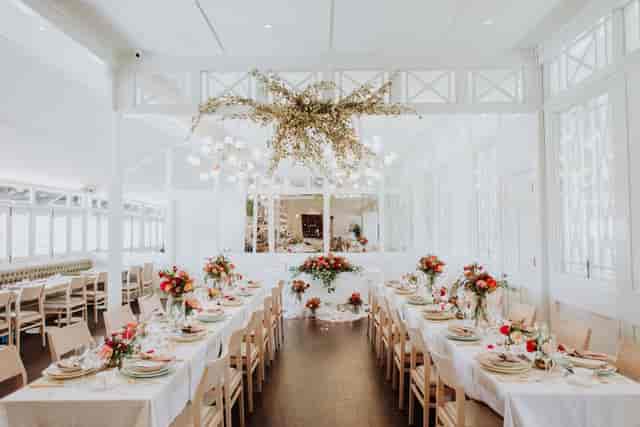 Elegant business seminar setup with floral centerpieces at Wheeler's Estate.