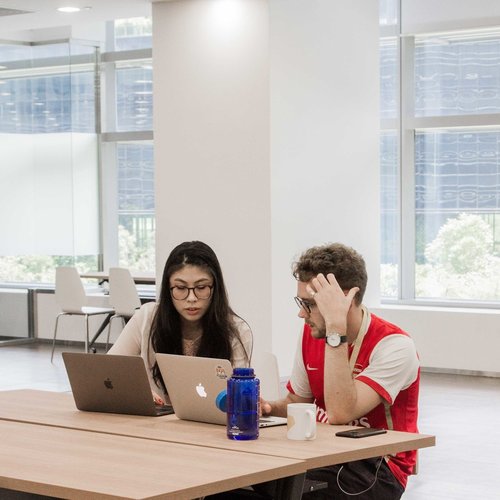 Professionals collaborating in a modern workspace for event planning and teamwork.