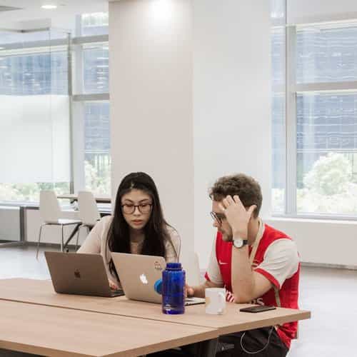 Professionals collaborating in a modern workspace for event planning and teamwork.