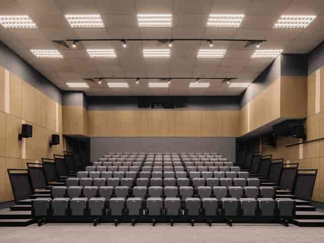 Modern auditorium with tiered seating for conferences and workshops at Common Ground Civic Centre.