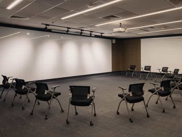 Auditorium at Common Ground Civic Centre with circular seating for workshops and meetings.