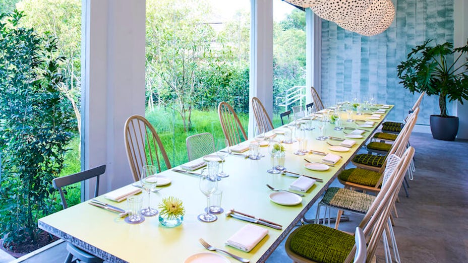 Private dining room at COMO Dempsey with a long table, ideal for events and gatherings.