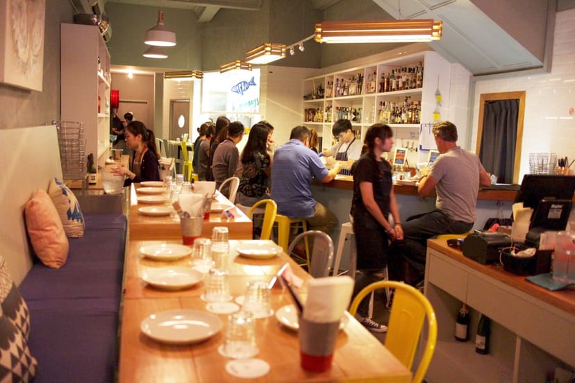 Modern dining area with cozy seating for casual meetings and networking events.