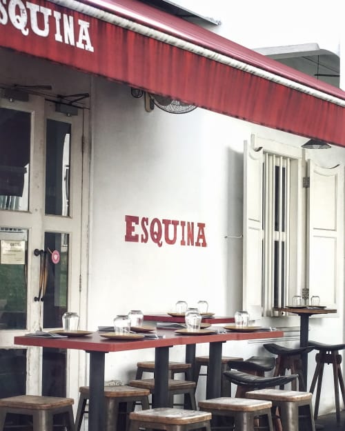 Charming Esquina restaurant with outdoor seating for intimate gatherings and networking events.