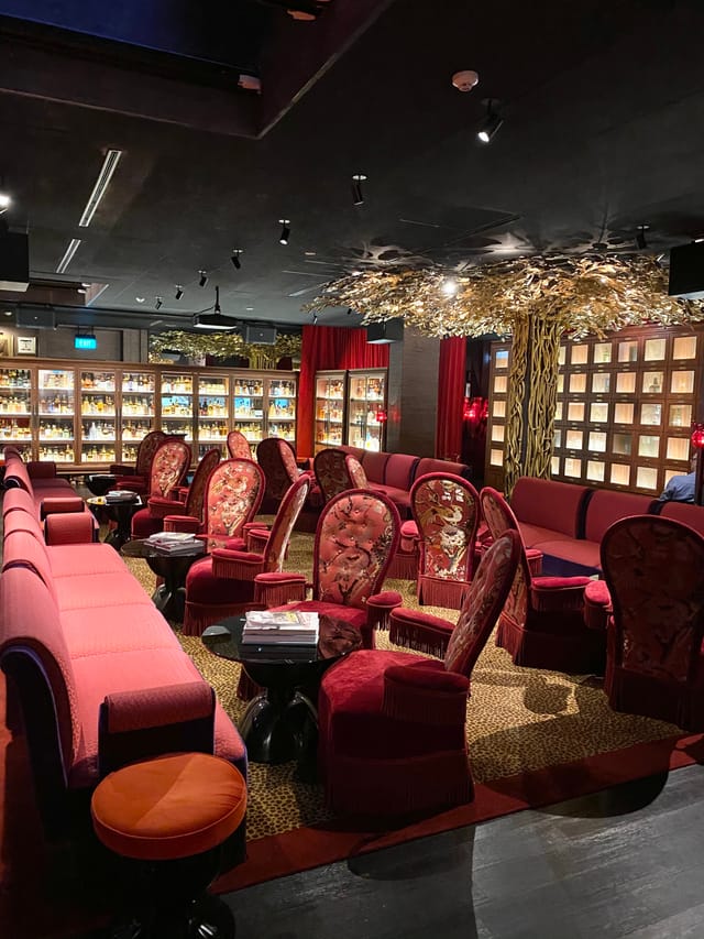 Whisky Library lounge with plush seating, ideal for networking events and intimate meetings.