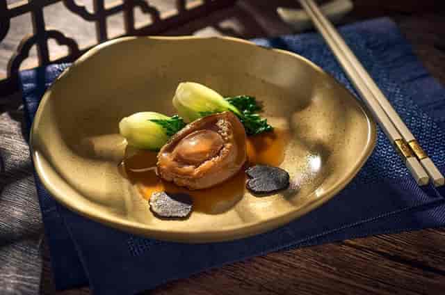 Elegant seafood dish in upscale restaurant, perfect for corporate events and fine dining.