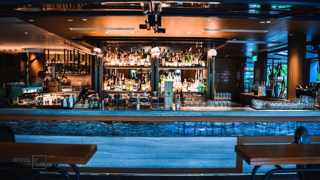 Sleek modern bar in Publico, ideal for networking events and social gatherings.