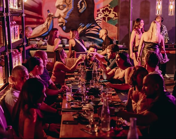 Vibrant cocktail bar at Neon Pigeon, perfect for networking events and celebrations.