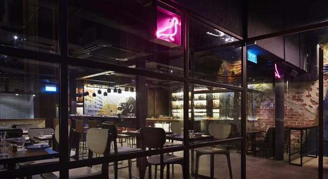 Modern Japanese restaurant with neon decor, ideal for corporate events and gatherings.