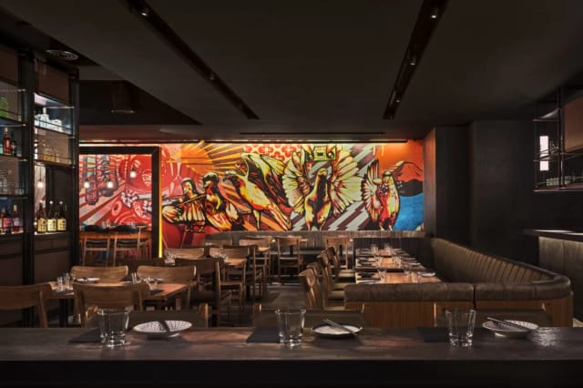 Vibrant Japanese restaurant with mural, perfect for networking events and dinners.