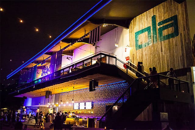 Vibrant Ola Beach Club bar with modern design, ideal for events and gatherings.