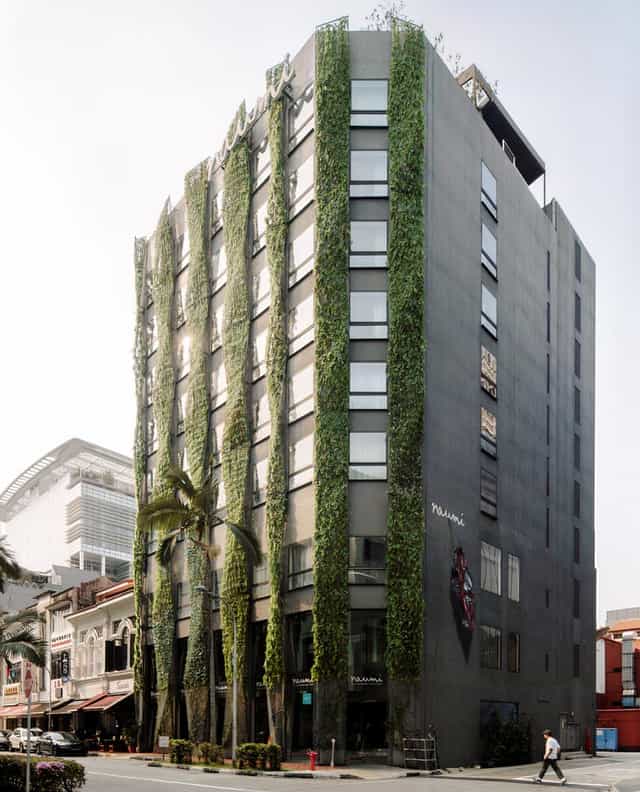Modern wedding venue at Naumi Hotel Singapore with striking green facade, ideal for eco-friendly events.