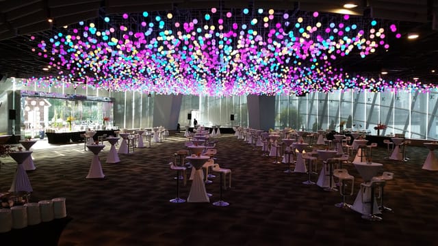 Waterview Room at Gardens by the Bay with colorful ceiling lights for events and gatherings.