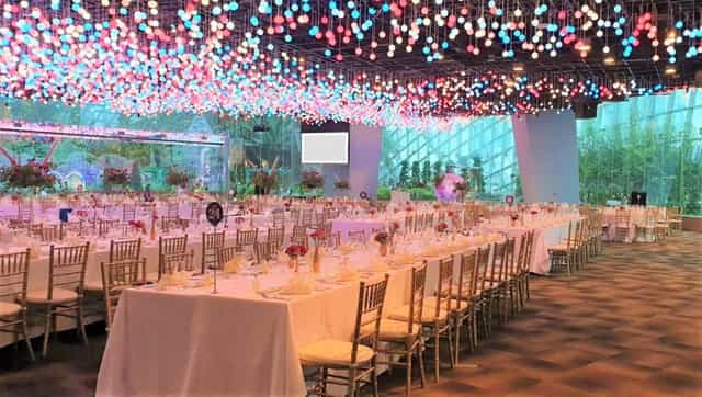 Flower Field Hall event space with floral centerpieces, ideal for celebrations and gatherings.