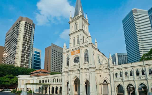 Terracotta church in CHIJMES, elegant backdrop for weddings and cultural events.