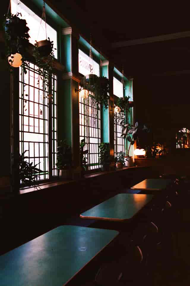 Cozy Marquee Moon Basement with stained glass, ideal for intimate gatherings and networking.