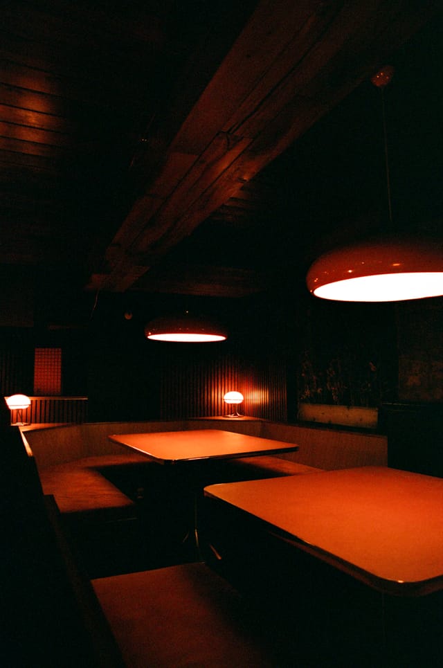 Cozy Marquee Moon Basement with warm lighting, perfect for creative meetings and discussions.