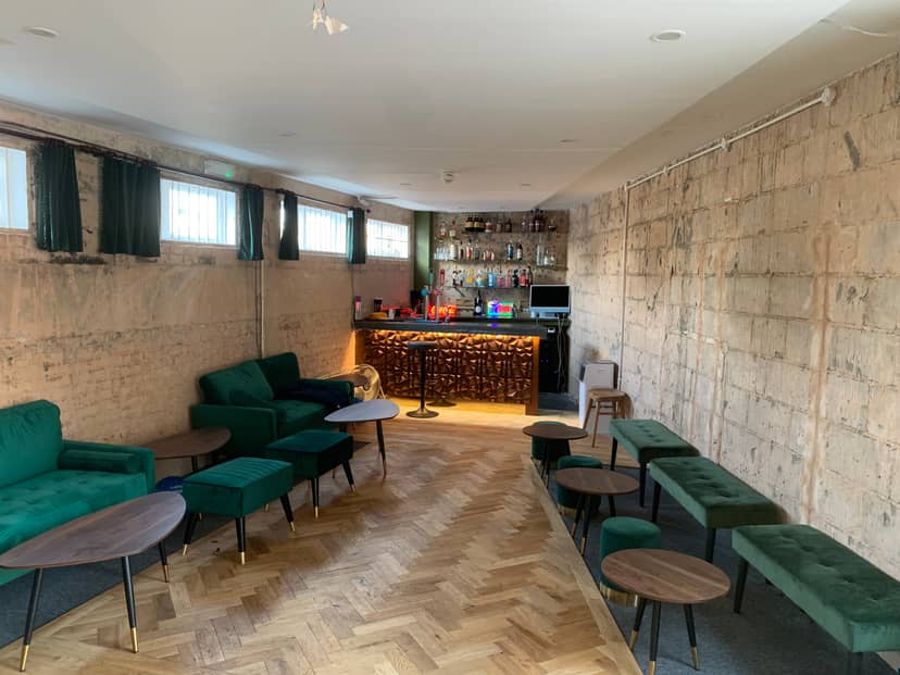 Stylish cocktail lounge bar with cozy seating, perfect for networking events.