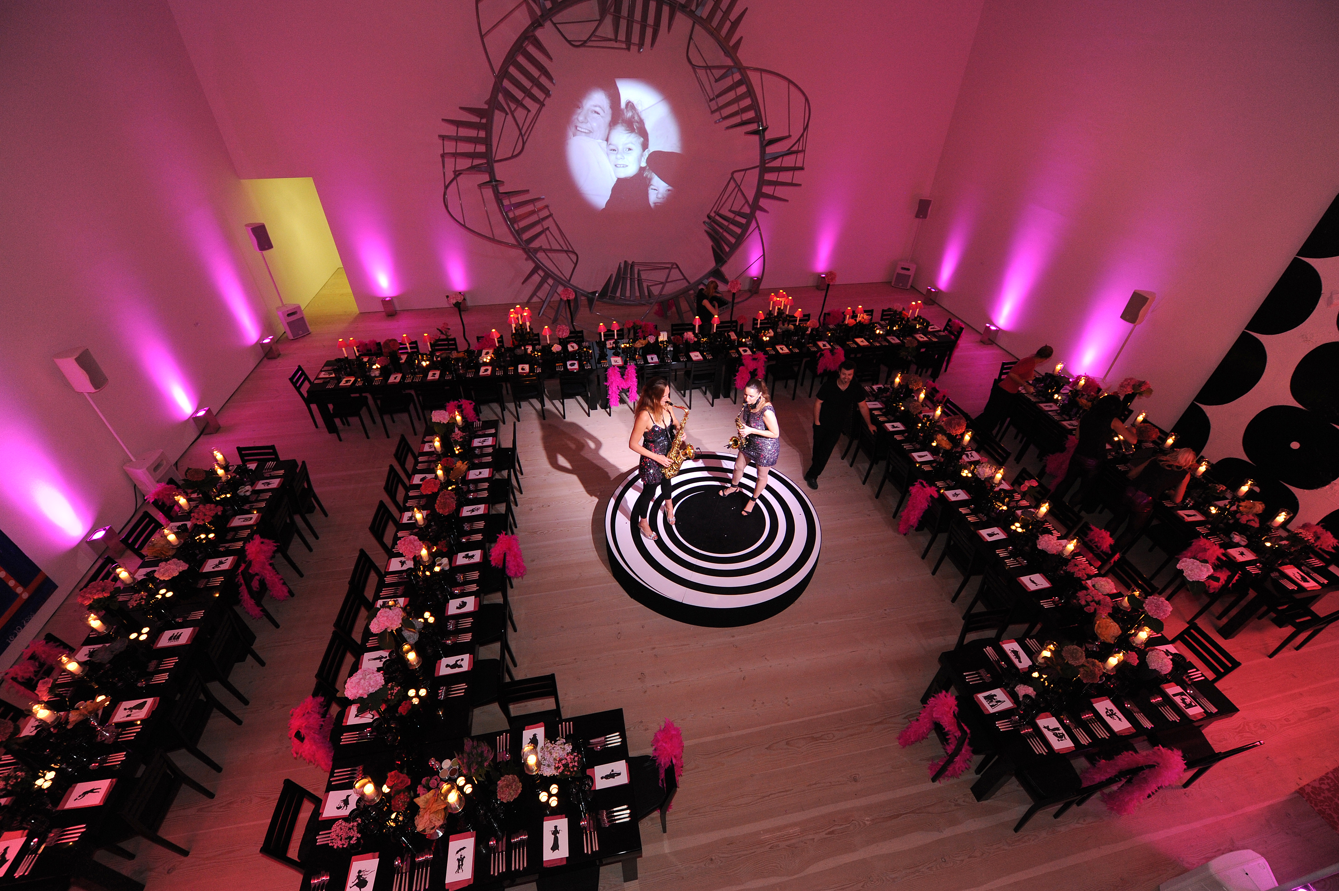 Elegant event setup at Saatchi Gallery with floral centerpieces, ideal for gala or corporate events. - Banner