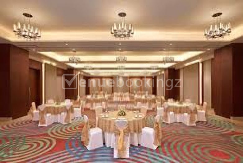Event space at Gateway Resort Damdama Lake with elegant round tables for weddings and corporate events.