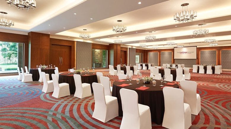 Meeting room at The Gateway Resort with elegant round tables for corporate events.