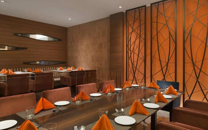 Conference Room at Taj Ganges Varanasi with elegant dining setup for corporate events.