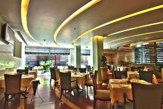Modern cafe in Jaypee Siddharth, elegant decor for upscale events and meetings.
