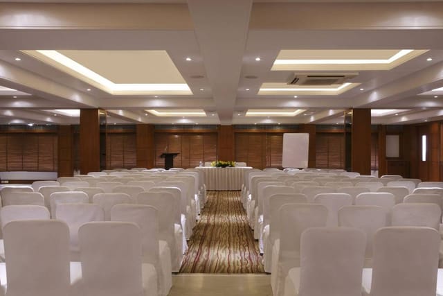 Banquet hall in Lemon Tree Premier Jaipur, featuring a professional conference setup.