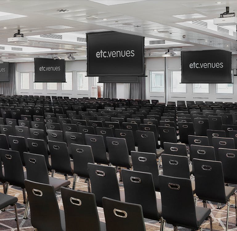 Knights Lounge event space with black chairs, ideal for conferences and seminars.