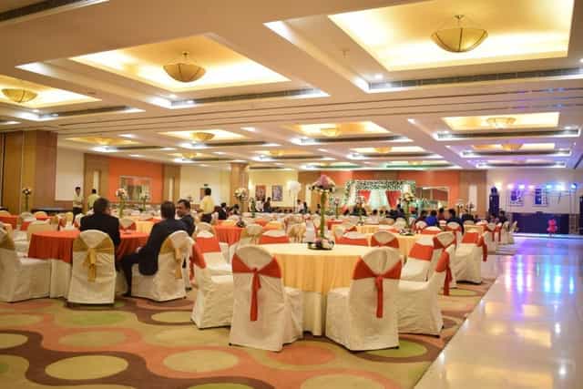 Banquet hall at Lemon Tree Hotel Kaushambi, elegantly arranged for weddings and corporate events.