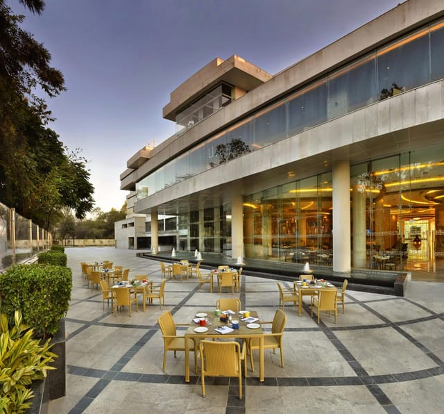 Modern outdoor dining area at The LaLiT Chandigarh, ideal for upscale events and gatherings.